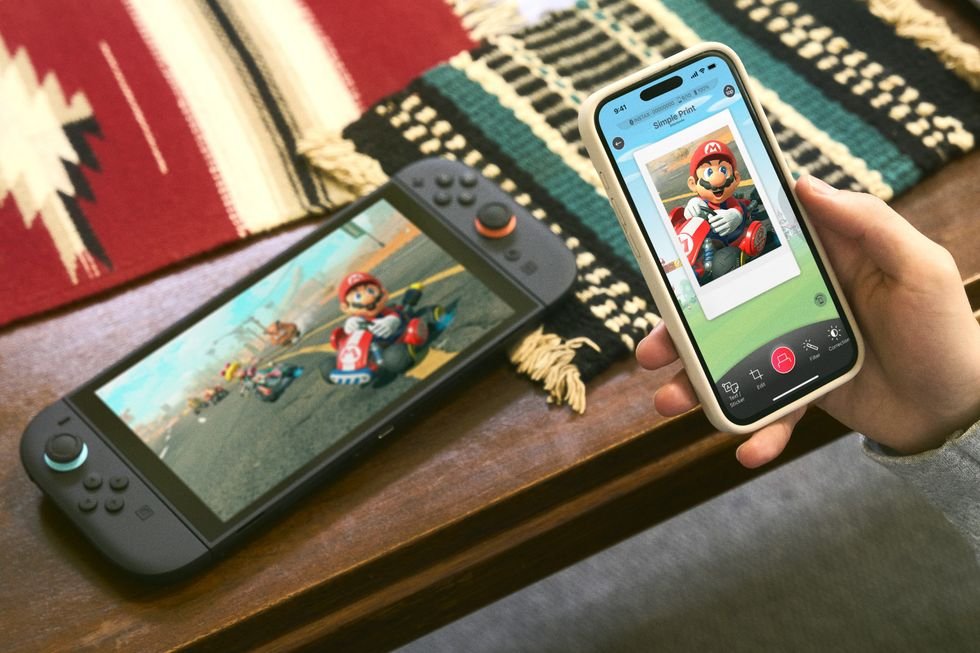 nintendo-switch-2-console-with-nintendo-switch-app-open-on-iphone